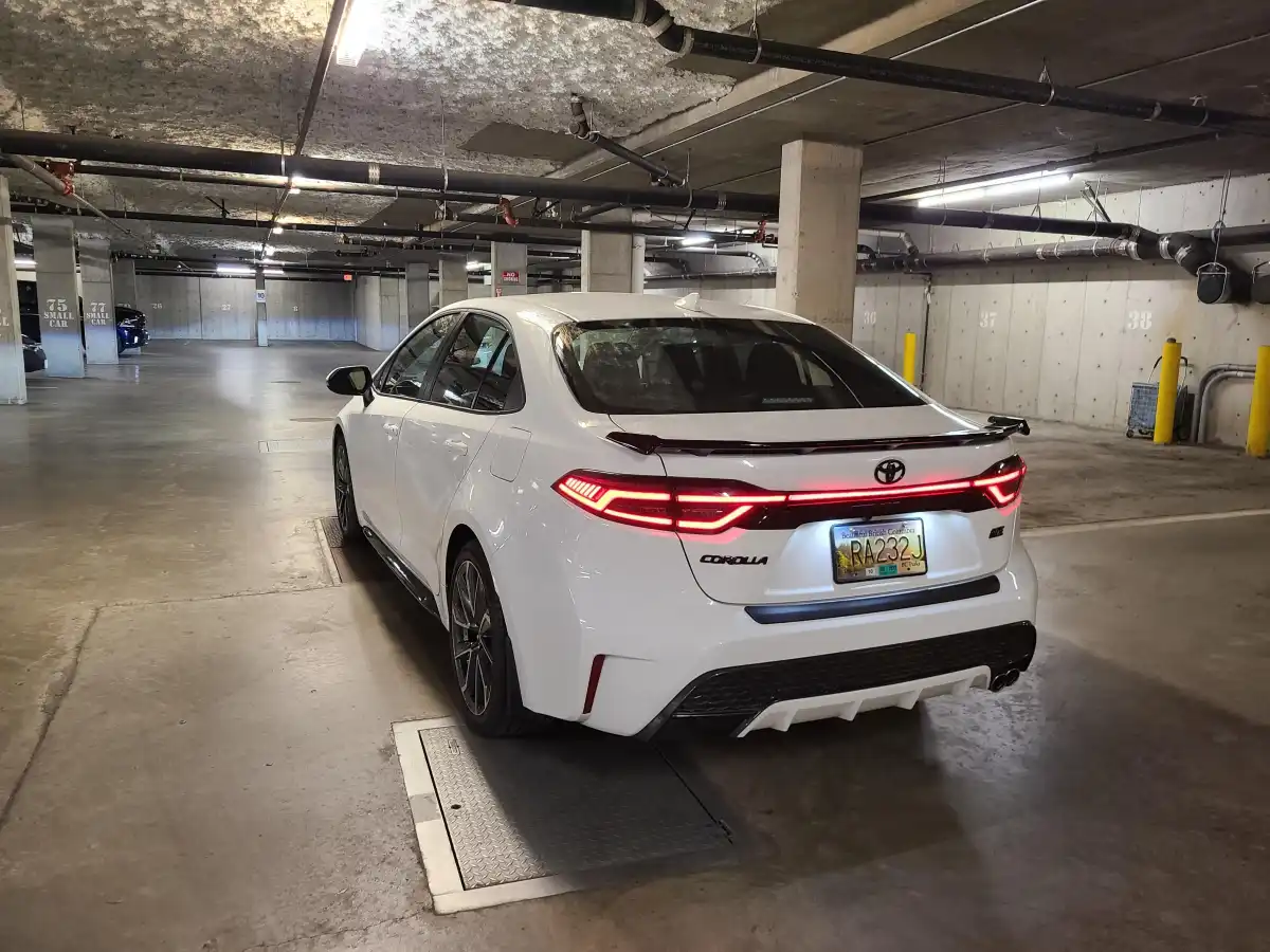 2025 Toyota Corolla rear view with modern LED taillights glowing